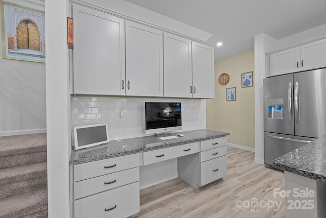 229 Cramerton Mills Parkway, Cramerton, NC 28032 - kitchen with stainless steel refrigerator with ice dispenser, baseboards, dark stone counters, white cabinetry, and recessed lighting