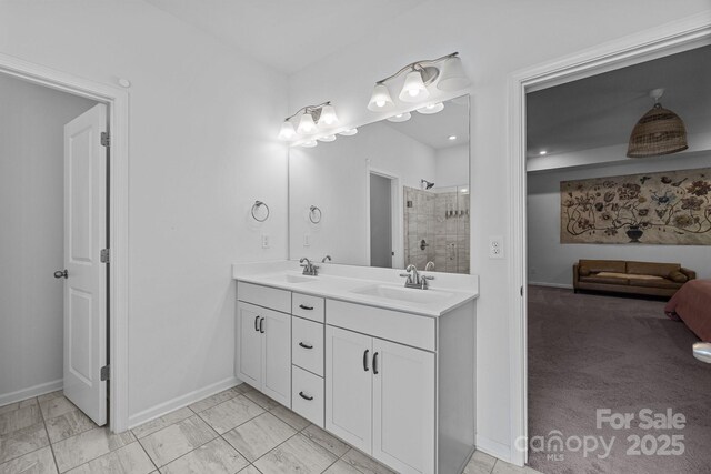 229 Cramerton Mills Parkway, Cramerton, NC 28032 - full bath featuring double vanity, baseboards, tiled shower, and marble finish flooring