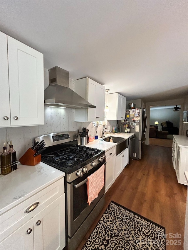 4850 Windy Ridge Rd, Morganton, NC 28655 - kitchen featuring stainless steel appliances, a sink, wall chimney exhaust hood, dark wood-style floors, and light countertops