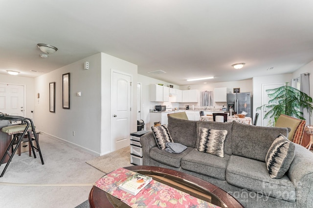 635 Scarlet Leaf Ln, Oakboro, NC 28129 - living room featuring light colored carpet and baseboards