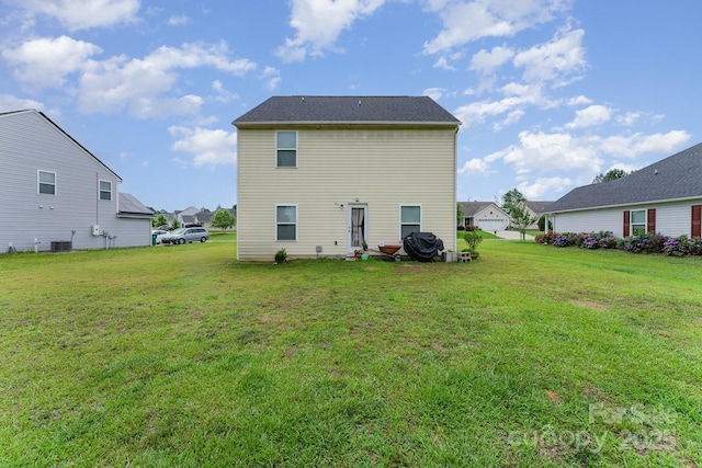 635 Scarlet Leaf Ln, Oakboro, NC 28129 - rear view of house featuring a lawn