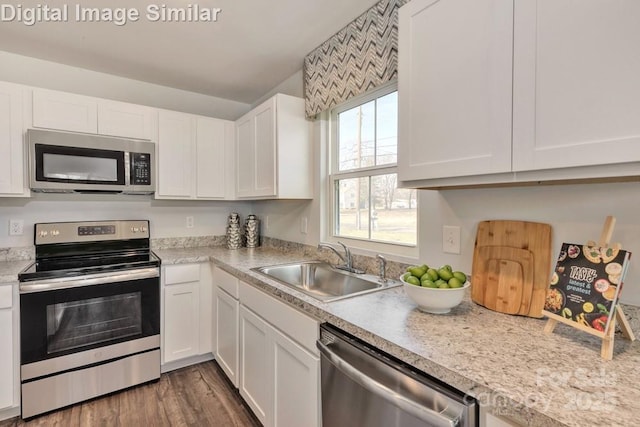 10127 Florentine Way, Charlotte, NC 28214 - kitchen featuring stainless steel appliances, a sink, white cabinets, and light countertops