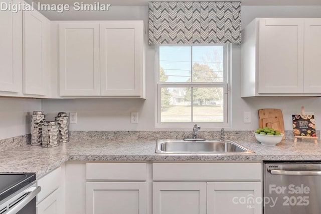 10127 Florentine Way, Charlotte, NC 28214 - kitchen with stainless steel dishwasher, a sink, white cabinets, and light countertops