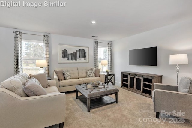 10127 Florentine Way, Charlotte, NC 28214 - living room featuring light carpet and recessed lighting