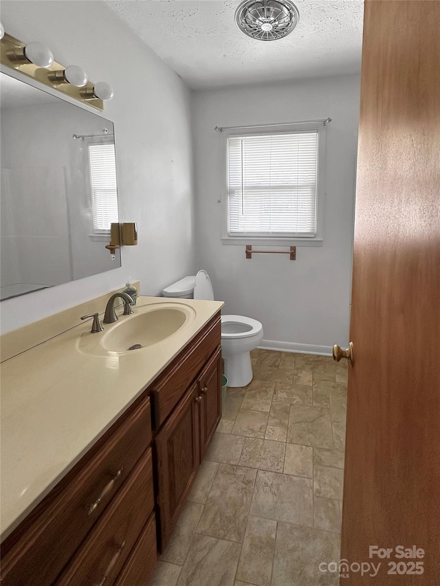 305 Rockdale Rd, Lawndale, NC 28090 - bathroom featuring vanity, a textured ceiling, and stone finish flooring