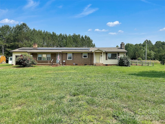 305 Rockdale Rd, Lawndale, NC 28090 - view of front of house with a chimney, roof mounted solar panels, and a front lawn