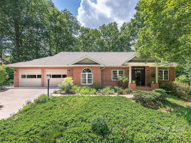306 Croydon Dr, Hendersonville, NC 28791 - ranch-style house with a garage, brick siding, concrete driveway, and a shingled roof