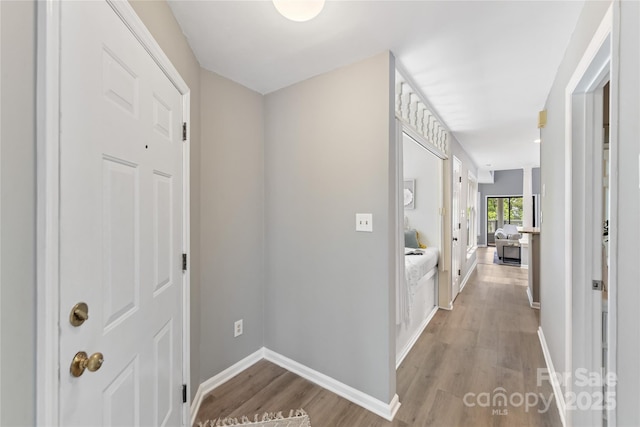 303 NW Dr, Davidson, NC 28036 - hallway featuring light wood finished floors and baseboards