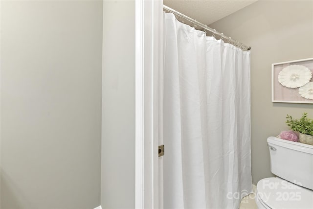 303 NW Dr, Davidson, NC 28036 - bathroom featuring toilet and curtained shower