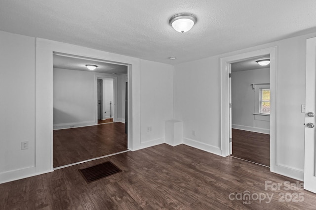 103 Garfield Ave, Albemarle, NC 28001 - unfurnished room with a textured ceiling, wood finished floors, and baseboards