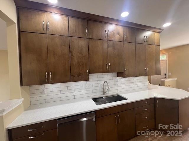 12378 Swan Wings Pl, Huntersville, NC 28078 - kitchen with dishwasher, a sink, backsplash, light countertops, and recessed lighting
