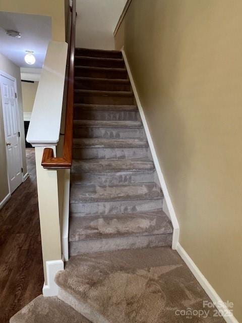 12378 Swan Wings Pl, Huntersville, NC 28078 - stairs with baseboards and wood finished floors