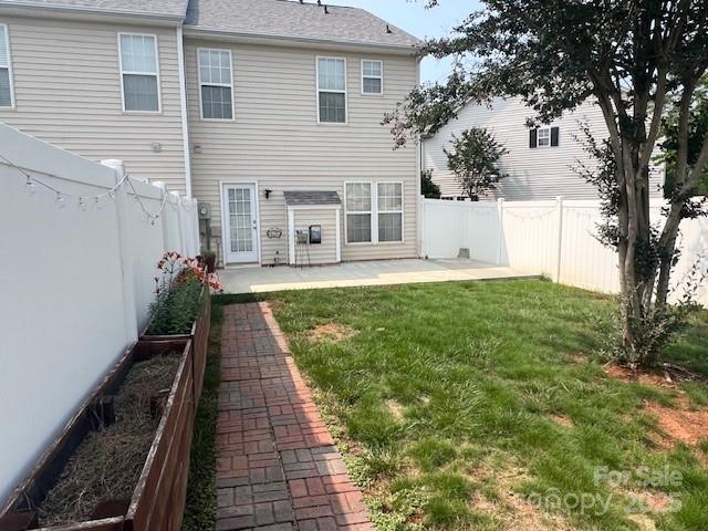 12378 Swan Wings Pl, Huntersville, NC 28078 - back of property with a patio area and a shingled roof