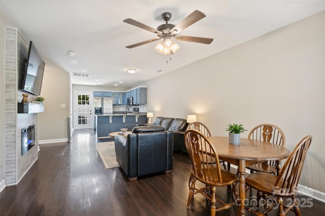 1925 Sandal Brook Rd, Indian Land, SC 29707 - living area featuring baseboards, ceiling fan, a fireplace, and dark wood-style flooring