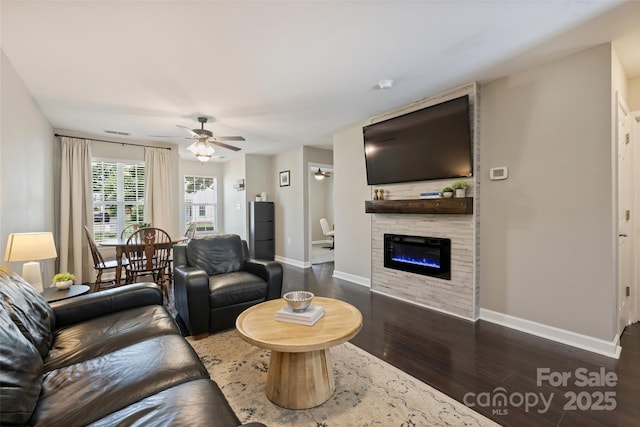 1925 Sandal Brook Rd, Indian Land, SC 29707 - living area with a ceiling fan, dark wood finished floors, baseboards, and a large fireplace