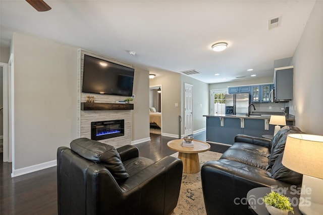 1925 Sandal Brook Rd, Indian Land, SC 29707 - living area with dark wood-style floors, baseboards, and a fireplace