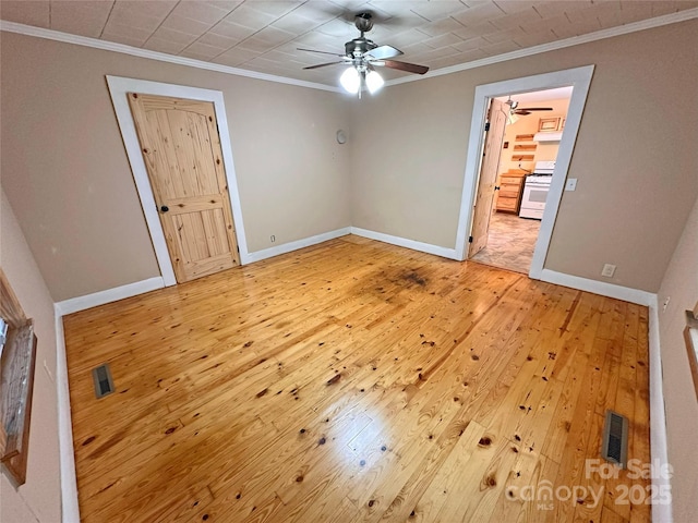 2131 E NC-10 Hwy, Conover, NC 28613 - empty room with crown molding, a ceiling fan, light wood finished floors, and baseboards