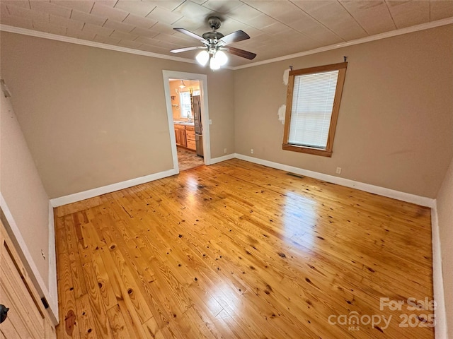 2131 E NC-10 Hwy, Conover, NC 28613 - empty room featuring ornamental molding, light wood finished floors, ceiling fan, and baseboards