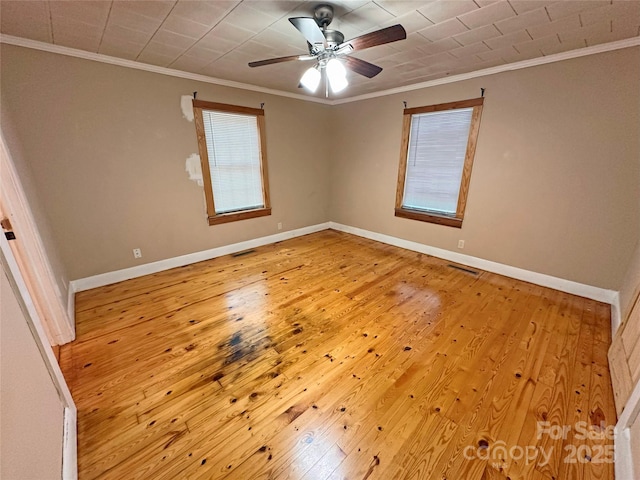 2131 E NC-10 Hwy, Conover, NC 28613 - unfurnished room with hardwood / wood-style flooring, crown molding, baseboards, and a ceiling fan