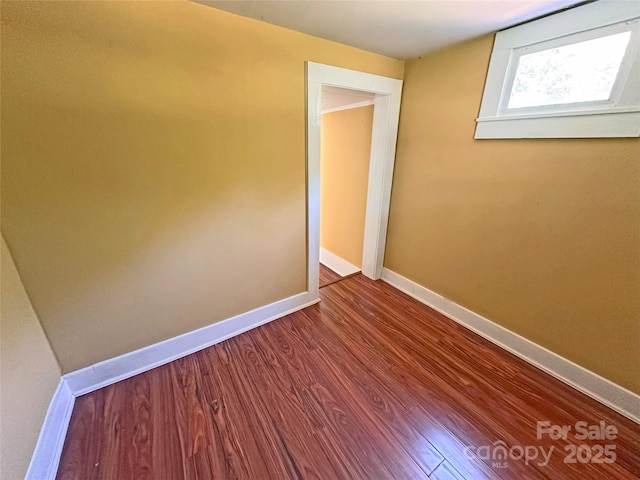 2131 E NC-10 Hwy, Conover, NC 28613 - spare room featuring baseboards and dark wood-style floors