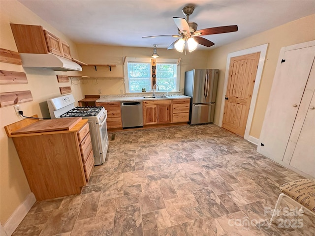 2131 E NC-10 Hwy, Conover, NC 28613 - kitchen featuring appliances with stainless steel finishes, a ceiling fan, a sink, and baseboards
