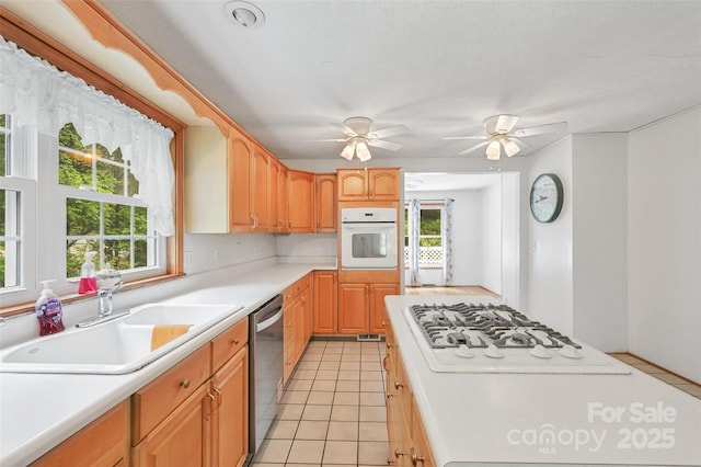 121 Walnut Holler Dr, Waynesville, NC 28786 - kitchen featuring white appliances, a sink, light countertops, and light tile patterned floors