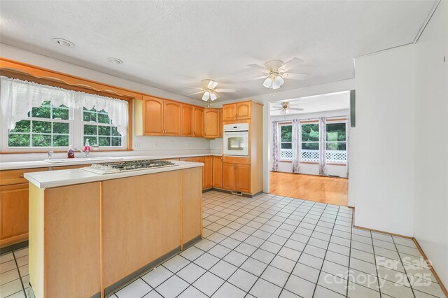 121 Walnut Holler Dr, Waynesville, NC 28786 - kitchen with oven, gas stovetop, light countertops, and a sink