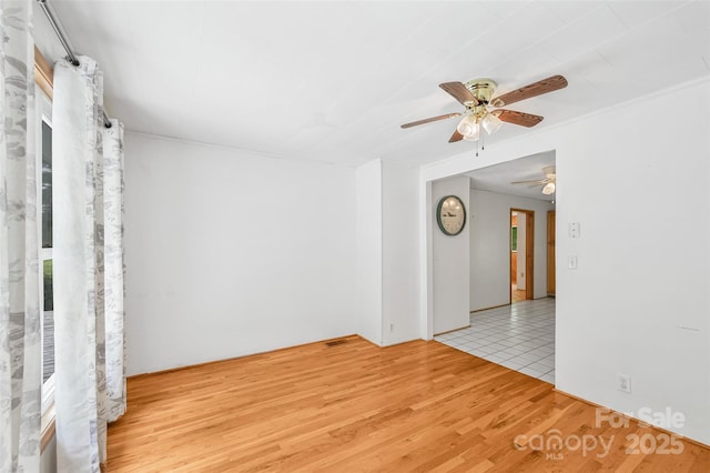 121 Walnut Holler Dr, Waynesville, NC 28786 - empty room with a ceiling fan and wood finished floors