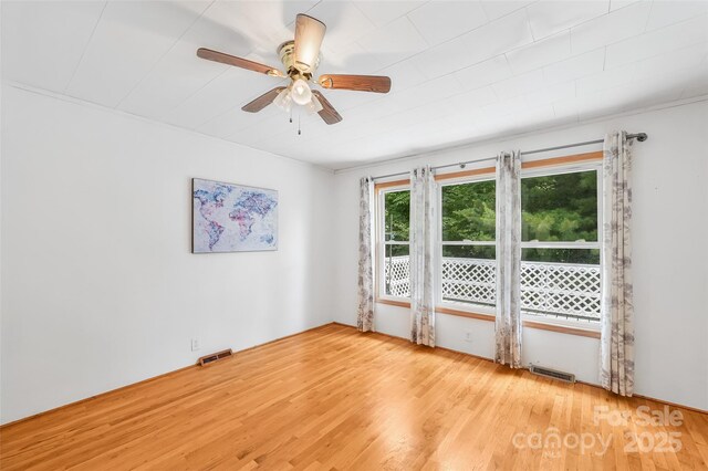 121 Walnut Holler Dr, Waynesville, NC 28786 - spare room featuring wood finished floors and a ceiling fan