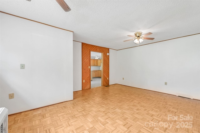 121 Walnut Holler Dr, Waynesville, NC 28786 - unfurnished room with ceiling fan, wooden walls, and a textured ceiling