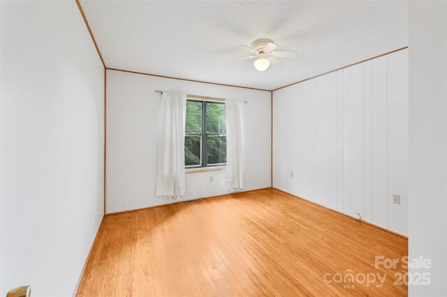 121 Walnut Holler Dr, Waynesville, NC 28786 - empty room with wood finished floors and ceiling fan
