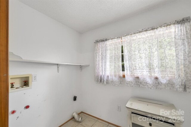 121 Walnut Holler Dr, Waynesville, NC 28786 - washroom with hookup for a washing machine, light tile patterned floors, a textured ceiling, and baseboards