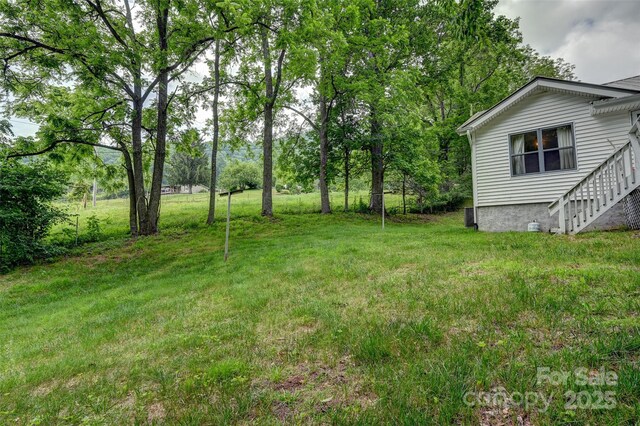 121 Walnut Holler Dr, Waynesville, NC 28786 - view of grassy yard featuring stairway