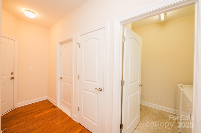 4518 Courtyard Blvd Unit 4, Harrisburg, NC 28075 - corridor with independent washer and dryer and light wood finished floors