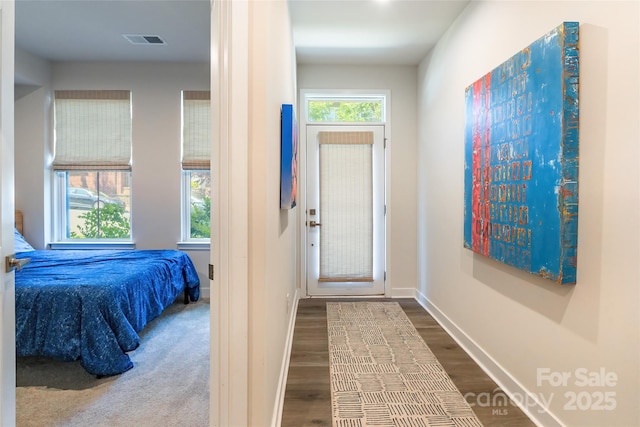 819 Anderson St, Charlotte, NC 28205 - foyer entrance featuring dark wood-type flooring and baseboards