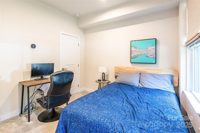 819 Anderson St, Charlotte, NC 28205 - carpeted bedroom featuring baseboards, a desk, and multiple windows