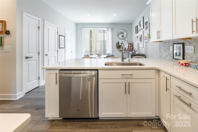 819 Anderson St, Charlotte, NC 28205 - kitchen with dishwasher, a sink, a peninsula, light countertops, and recessed lighting