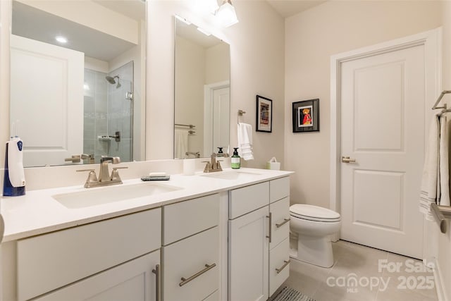 819 Anderson St, Charlotte, NC 28205 - bathroom featuring tile patterned flooring, double vanity, a shower stall, and toilet