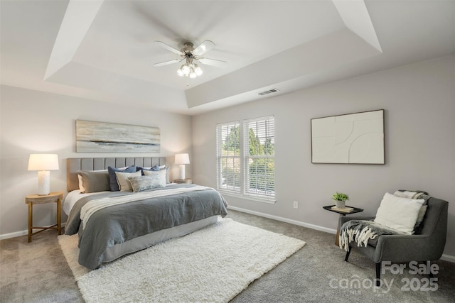 10225 Alexander Martin Ave, Charlotte, NC 28277 - carpeted bedroom featuring a tray ceiling and ceiling fan