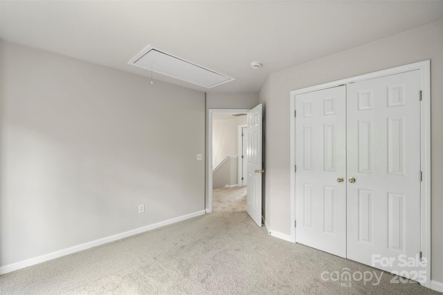 10225 Alexander Martin Ave, Charlotte, NC 28277 - unfurnished bedroom featuring attic access, carpet floors, and a closet