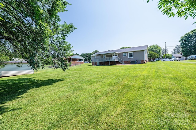 2031 36th St NE, Hickory, NC 28601 - view of grassy yard with stairway and a deck