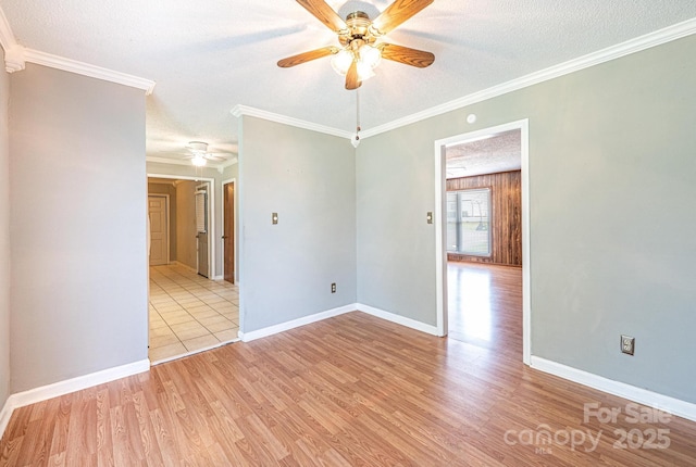 2031 36th St NE, Hickory, NC 28601 - empty room featuring a ceiling fan, light wood-style floors, baseboards, a textured ceiling, and ornamental molding
