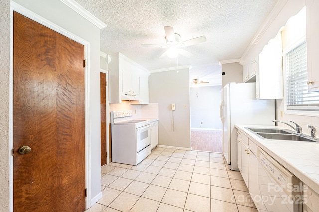 2031 36th St NE, Hickory, NC 28601 - kitchen with white appliances, a sink, a ceiling fan, under cabinet range hood, and tile counters