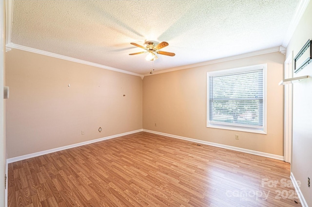 2031 36th St NE, Hickory, NC 28601 - unfurnished room with a textured ceiling, ceiling fan, light wood-type flooring, crown molding, and baseboards