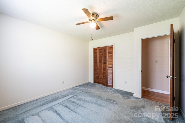 2031 36th St NE, Hickory, NC 28601 - unfurnished bedroom with carpet, a closet, baseboards, and a ceiling fan