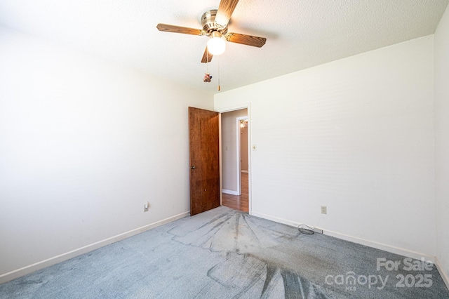 2031 36th St NE, Hickory, NC 28601 - unfurnished room featuring a ceiling fan, carpet floors, and baseboards