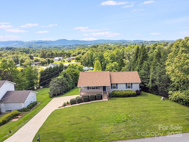 87 Collins Rd, Marshall, NC 28753 - view of subject property with a heavily wooded area and a mountainous background