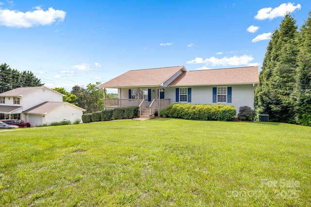 87 Collins Rd, Marshall, NC 28753 - ranch-style house with a front lawn, covered porch, and central AC