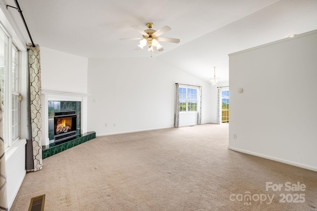 87 Collins Rd, Marshall, NC 28753 - unfurnished living room featuring vaulted ceiling, a ceiling fan, a high end fireplace, carpet floors, and baseboards