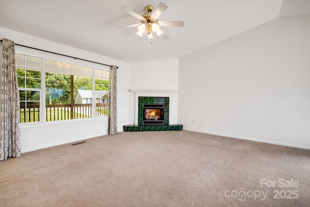 87 Collins Rd, Marshall, NC 28753 - unfurnished living room featuring carpet floors, baseboards, a ceiling fan, and a tile fireplace